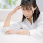 体調不良の女性